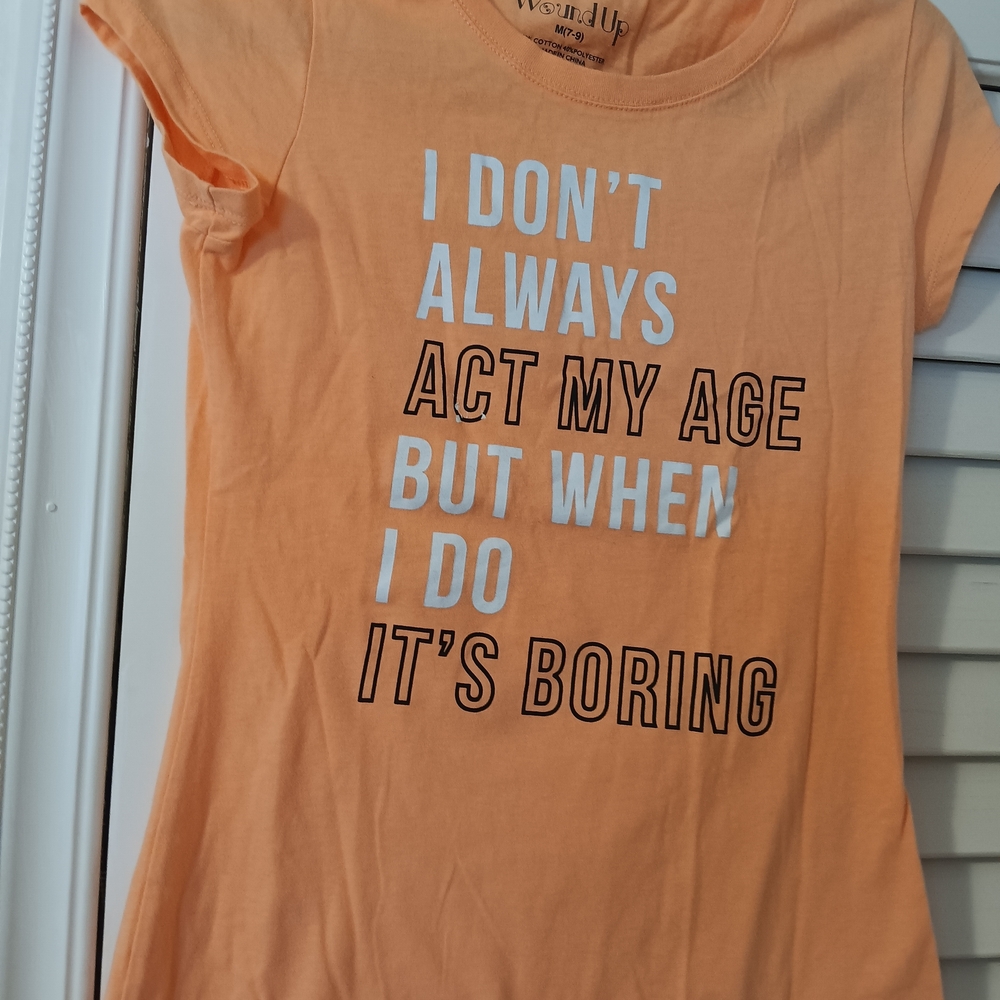 Wound Up Peach Graphic Tee with White Slogan
